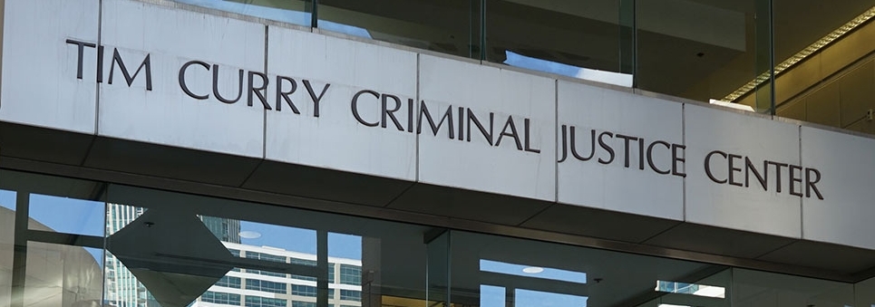 Sign on building of Tim Curry Criminal Justice Center