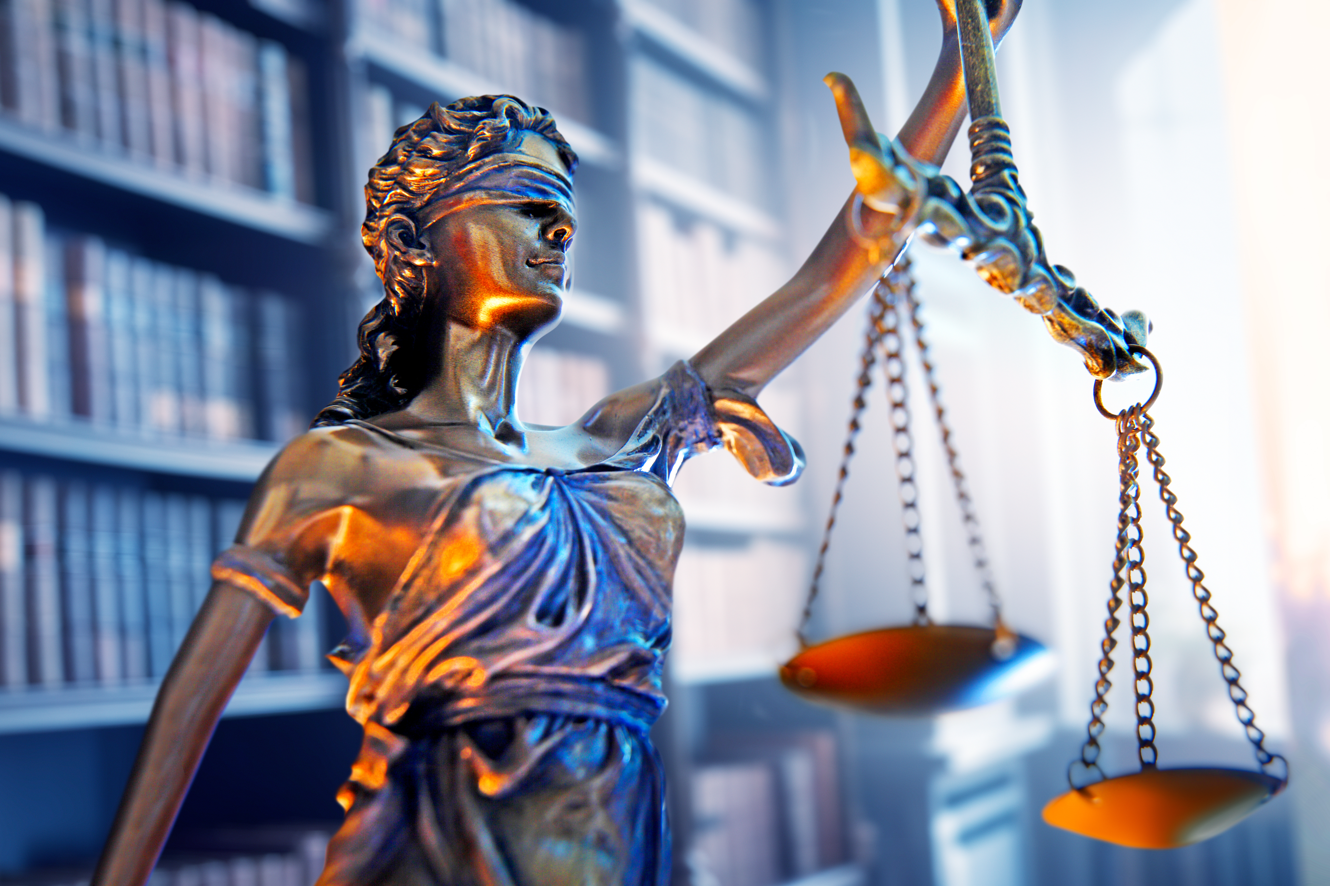 Lady justice holding the scales of justice.