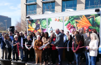 Commissioner Simmons cutting the ribbon at Arlington Charties Mobile food pantry