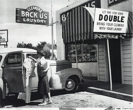 Katherine Backus Durbin in front of Back Us Laundry, undated