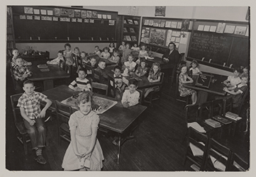 Photograph showing Martha Jane Green Hess with her second grade students in a classroom at Denver Avenue Elementary School, 1950