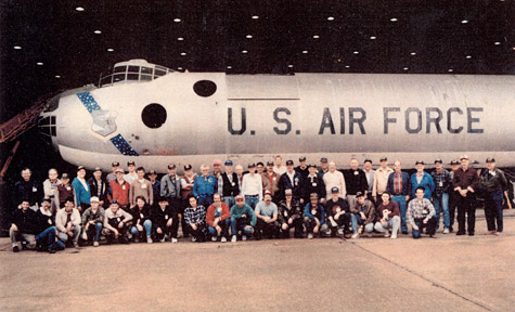 USAF airplane with large group of people posing in front of it
