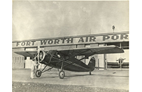 Aircraft on Tarmac at Fort Worth Air Port with Pilot in Cockpit and Man on Ground Turning Propeller, photograph, undated