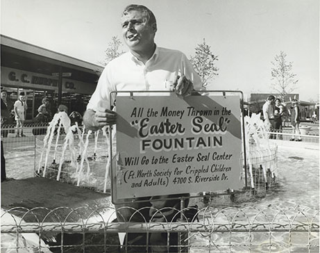 Donor holding sign for Easter Seal Fountain