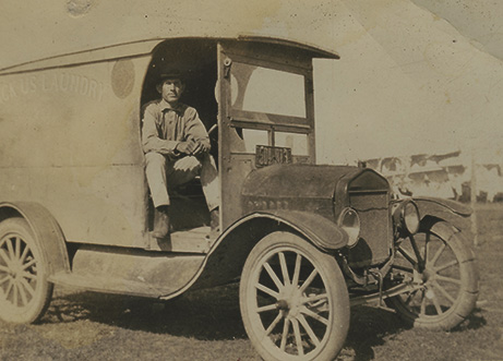 Lando Harris on Backus Laundry truck, 1924