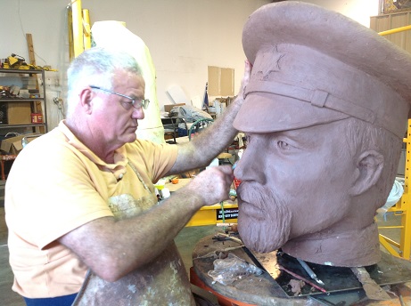 Archie St. Clair sculpting Major Ripley Arnold's head