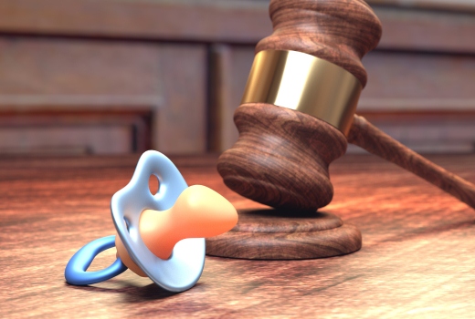 Gavel and baby pacifier