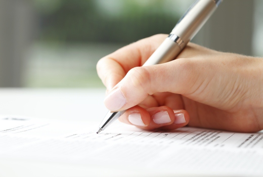 Image of someone writing