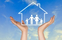 hands holding a house model