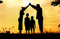 parents holding up their hands with children under