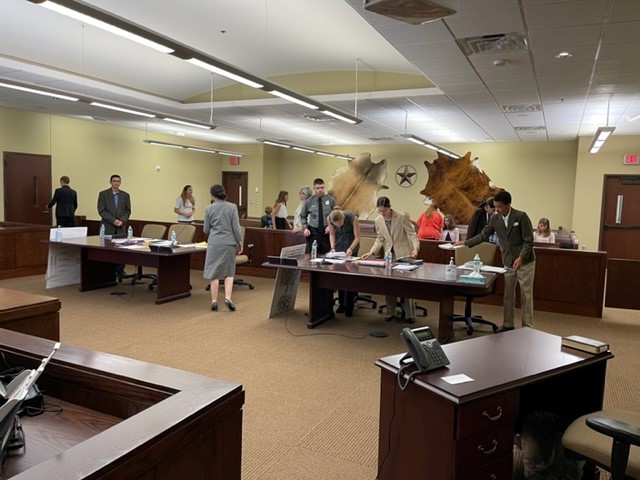 HOMESCHOOL STUDENTS SETTING UP FOR MOCK TRIAL