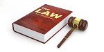 law book with red cover and gavel