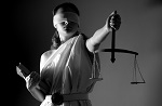 woman as blindfolded justice holding scales