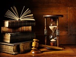 hourglass, gavel, and old books