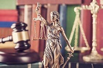 Justice statue with gavel and scales
