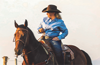 A woman riding a horse