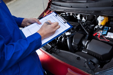 Mechanic checking engine