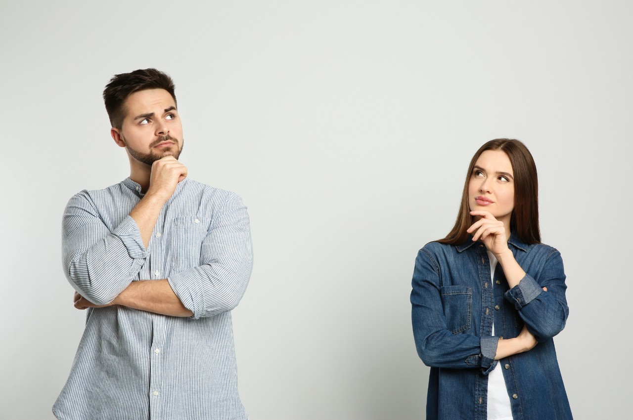 standing couple with a thinking pose