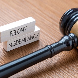 Felony, misdemeanor sign with gavel