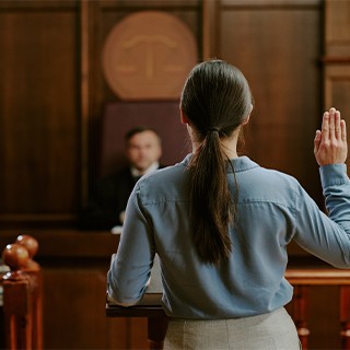 Picture of a lady swearing in the court