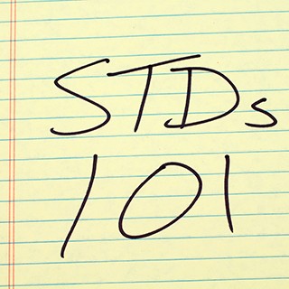 yellow note pad with STDs 101 written on it