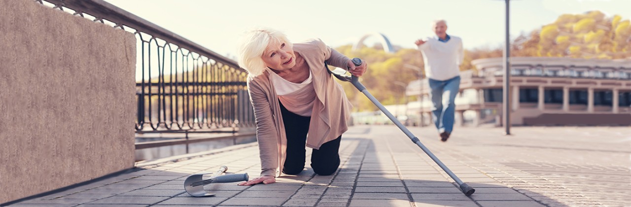 elderly woman falls while husband runs toward her