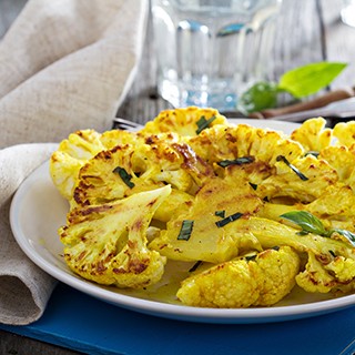 Roasted cauliflower with lemon and herbs on a plate