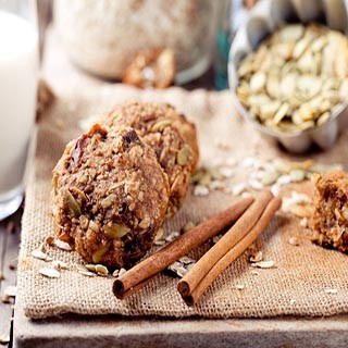Peanut butter and oats in a ball with cinnamon sticks