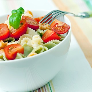 Cherry tomatoes and pasta in a bowl