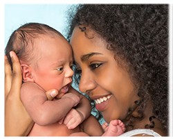 Woman and newborn baby