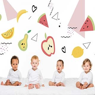 Infants sitting on a blanket 