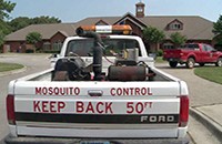 Back of a mosquito control spray truck
