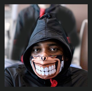 Young man in hoodie wearing goofy protective mask