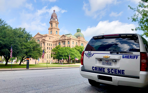 Crime Scene vehicle parked across the street from the Tarrant County Court building.