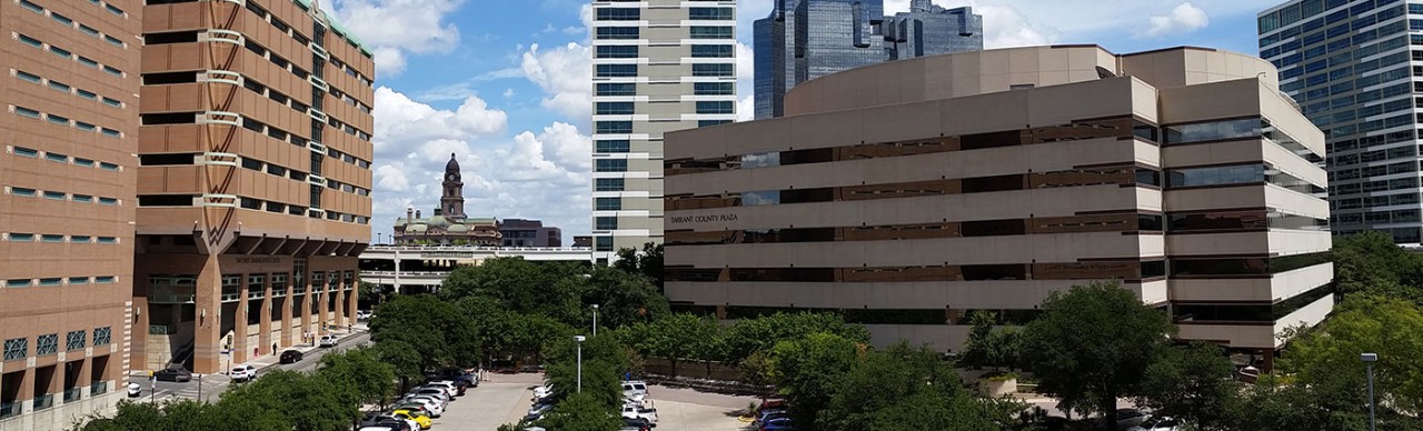 Panorama view of the Tarrant County Plaza Building with the 1895 Courthouse in the background